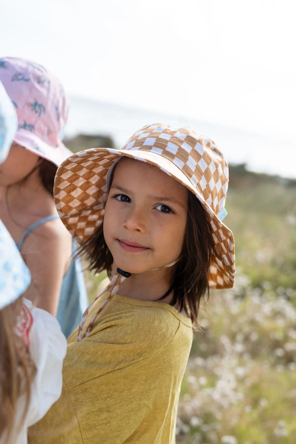 acorn kids: Checkmate Wide Brim Bucket Hat Caramel and Cream