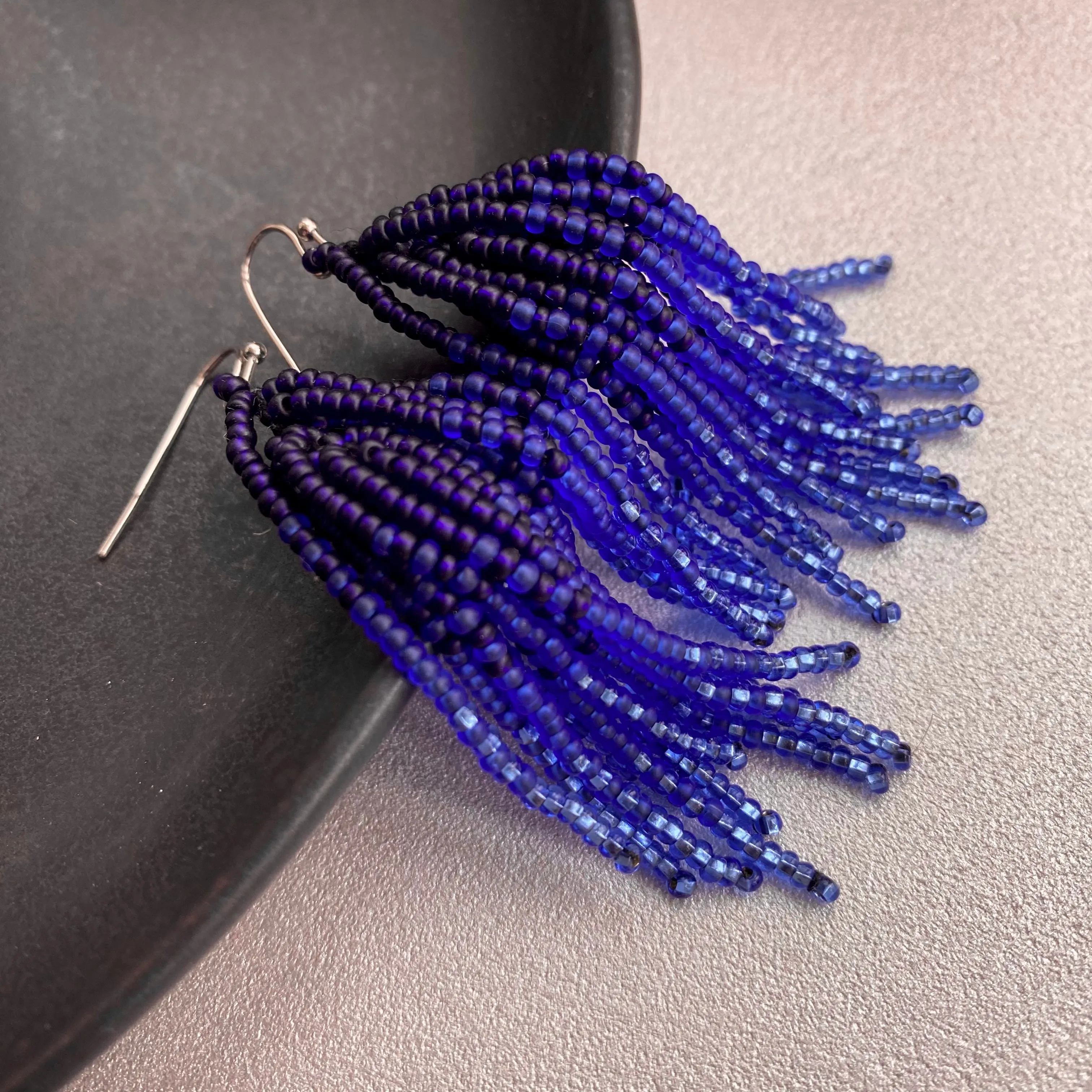 Handmade Blue Ombre Seed Bead Tassel Earrings for Women in boho hippie style.